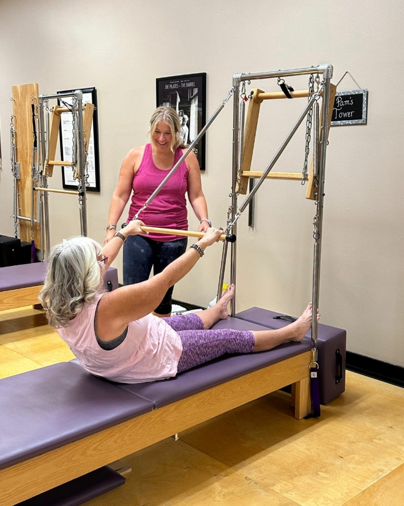 A client guided in a Pilates Tower Exercise by Carey Sadler, owner of Rivercity Pilates.   