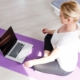 Picture of woman getting ready to view an on-demand session from Rivercity Pilates on her computer