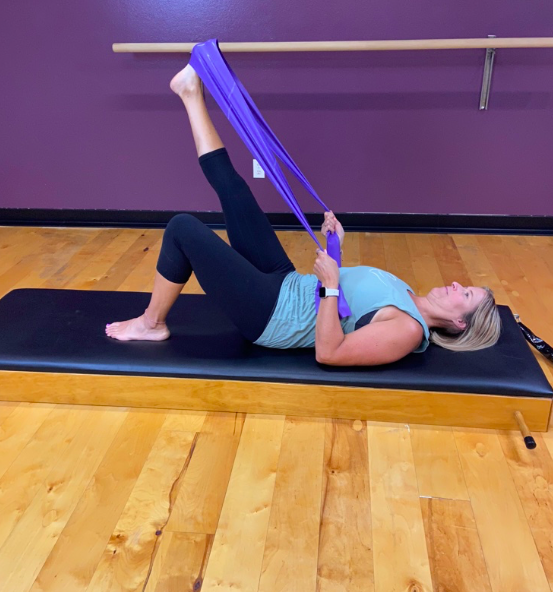 pilates for back pain - leg stretch.