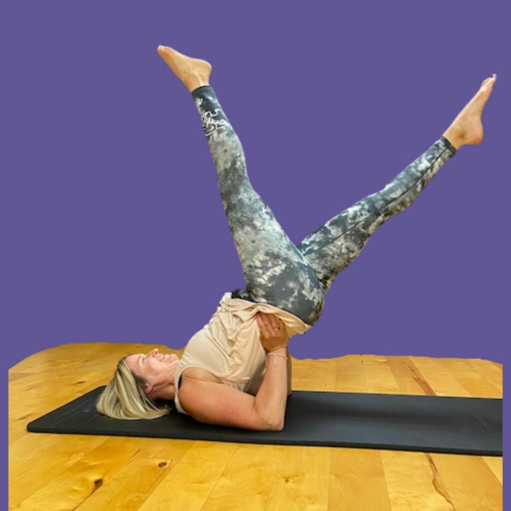 Carey Sadler demonstrating a Pilates exercise at Rivercity Pilates