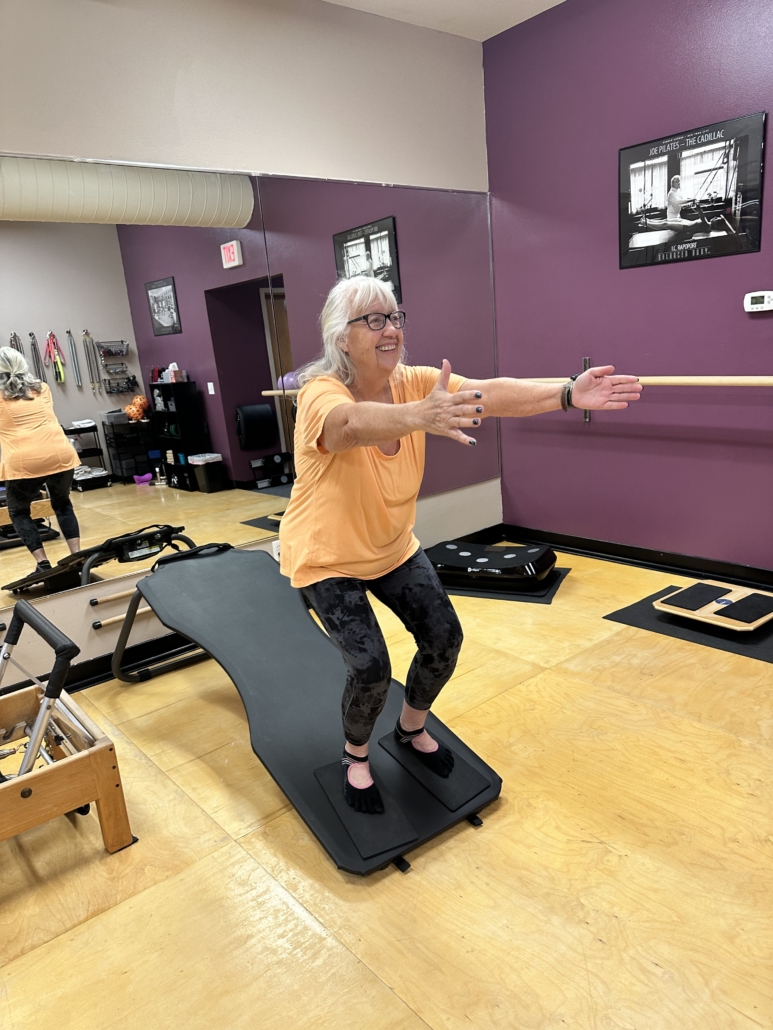 Practicing getting up and down on the slant board at Rivercity Pilates.  