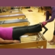 client on a Pilates reformer at RIvercity Pilates.