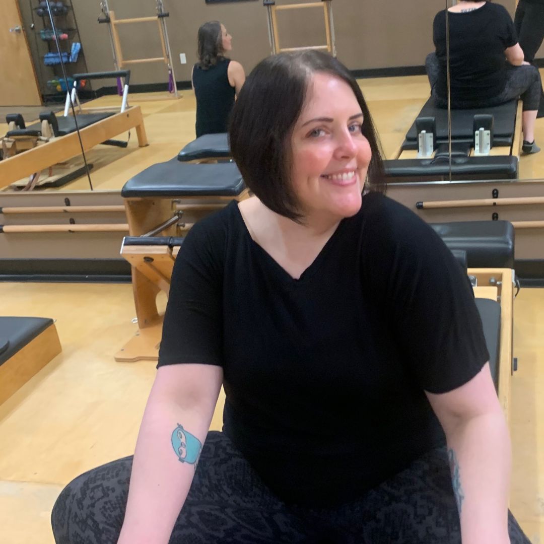 Rachel Piper smiling and teaching Pilates at Rivercity Pilates.